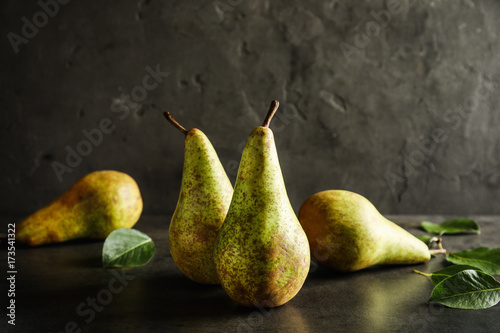 Ripe pears on dark background