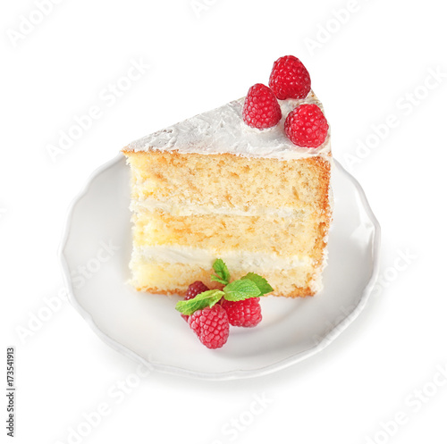 Slice of delicious cake with raspberries on white background