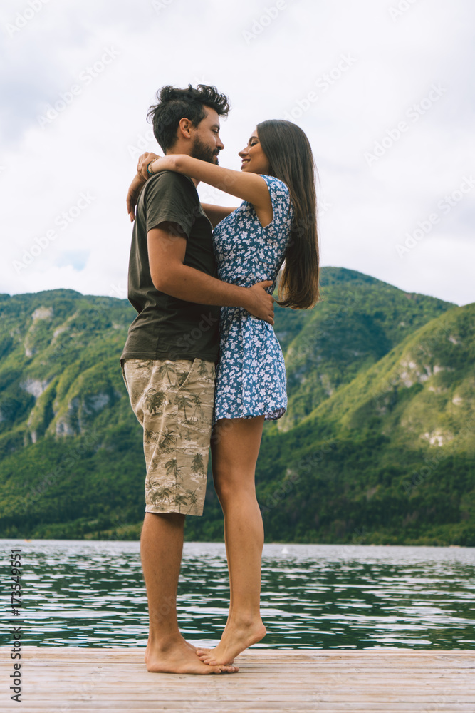 Couple posing on pier