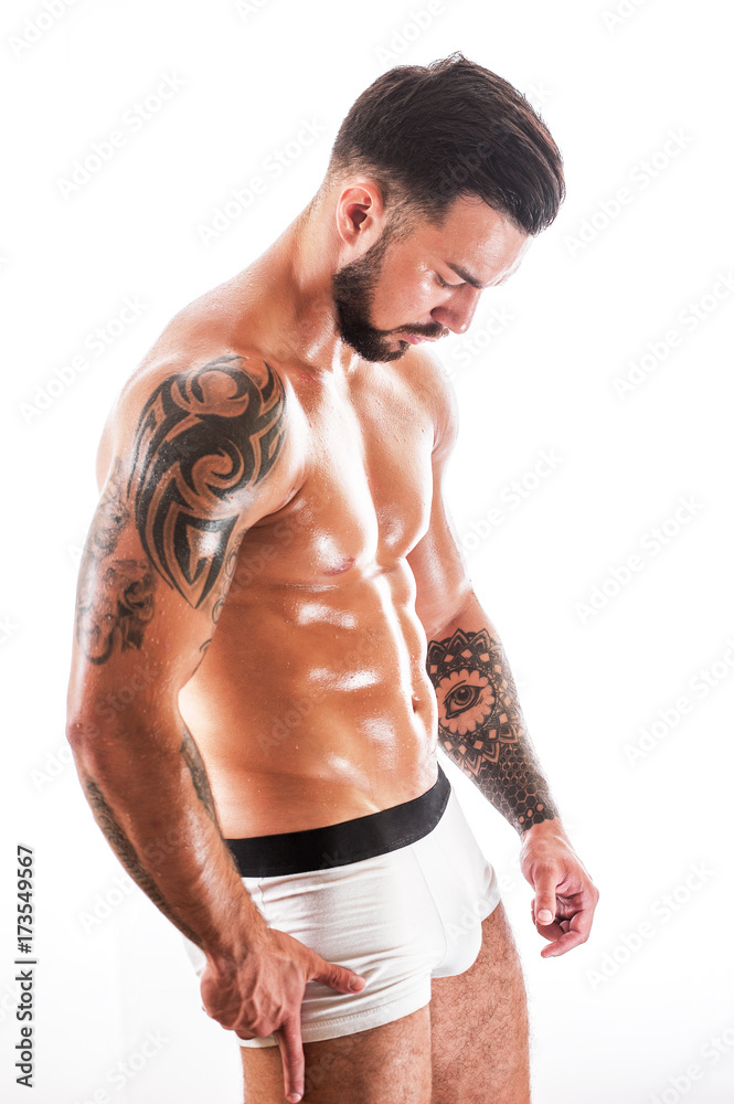 Athletic sexy man with tattooed torso in underwear Stock Photo | Adobe Stock
