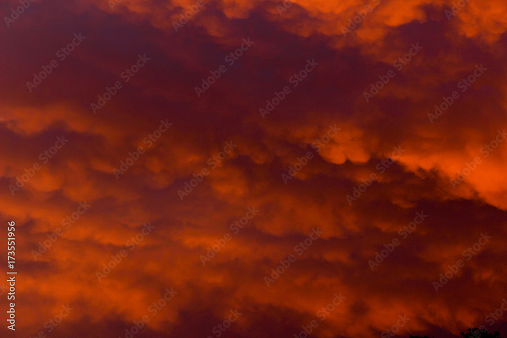 crimson cloudy sky at sunset