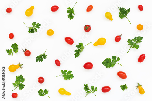 Vegetable Pattern of red yellow tomatoes, greens, parsley. Salad on White background