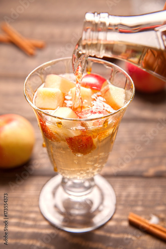 Apple cider cocktail with cinnamon and apple