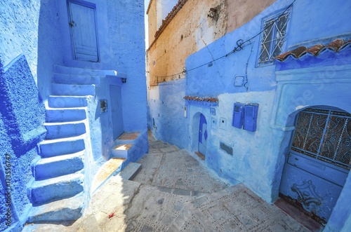 Street with stairs in Medina of Chefchaouen, Morocco. Chefchaouen or Chaouen is known that the houses in this old town are painted in the striking, variously blue hued © Mariana Ianovska