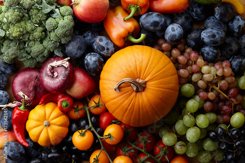 Fototapeta Naklejka Na Ścianę i Meble -  Autumn harvest concept. Seasonal fruits and vegetables on a wooden table, top view