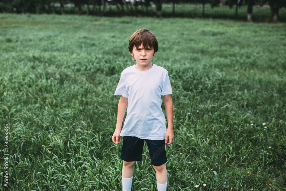 Creative portrait of a boy in sportswear outdoors. Creative portrait of a boy in sportswear outdoors.