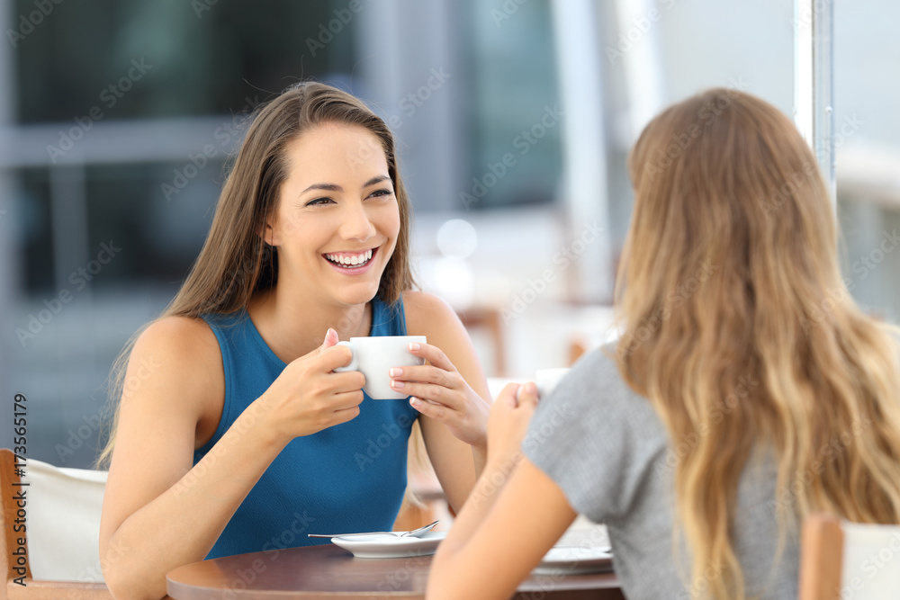 Two happy friends having a casual conversation Two happy friends having a casual conversation