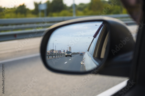 look in the rear view mirror of a car photo