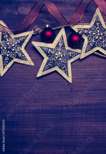 Christmas background with decorations on wooden board