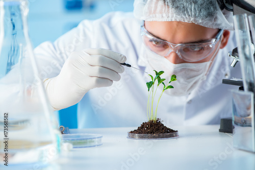 Biotechnology concept with scientist in lab photo