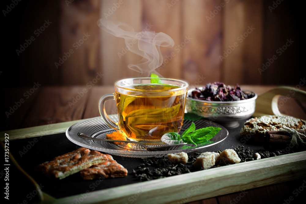 Tea in a cup on an old background Tea in a cup on an old background