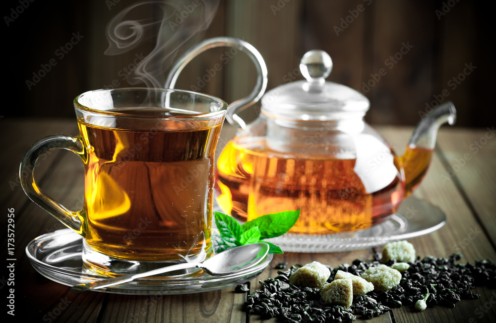 Tea in a cup on an old background Tea in a cup on an old background