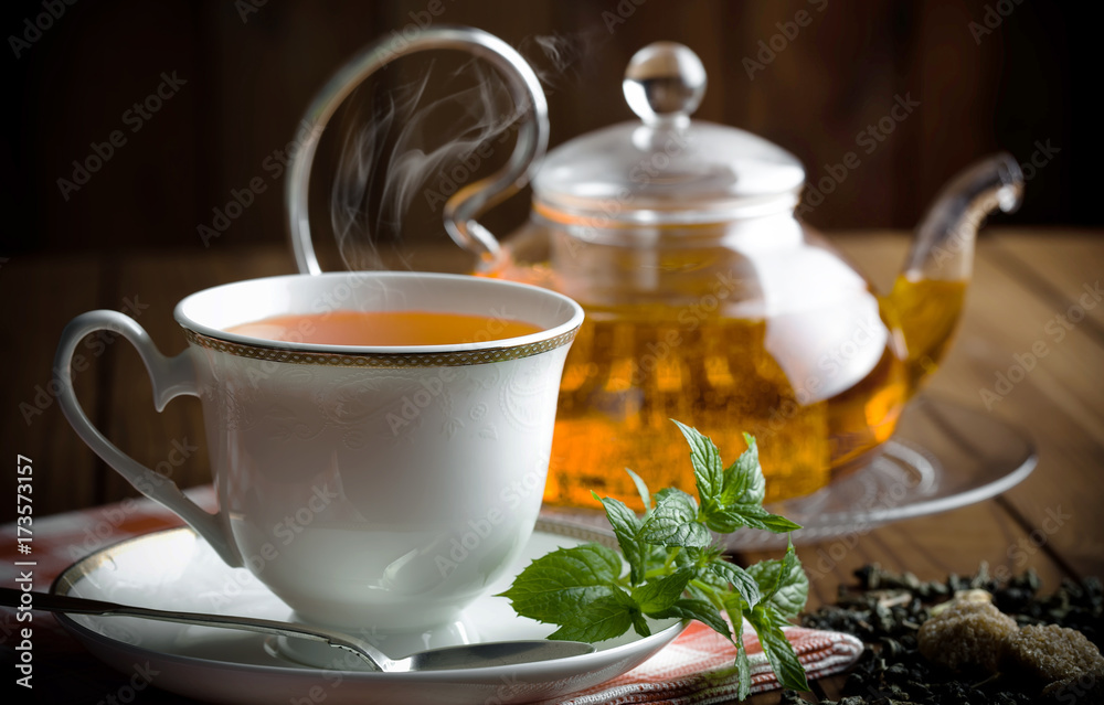 Tea in a cup on an old background Tea in a cup on an old background
