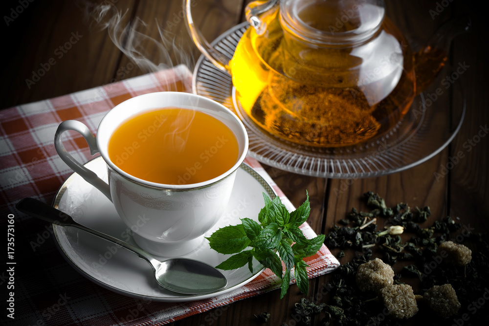 Tea in a cup on an old background Tea in a cup on an old background