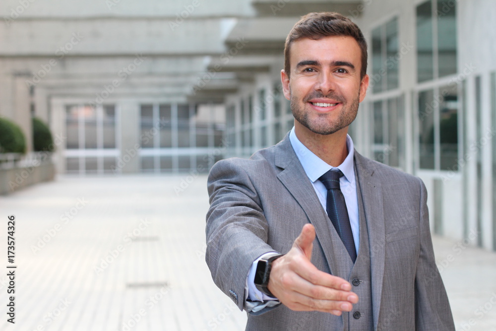 Businessman welcoming someone in the office building Businessman welcoming someone in the office building