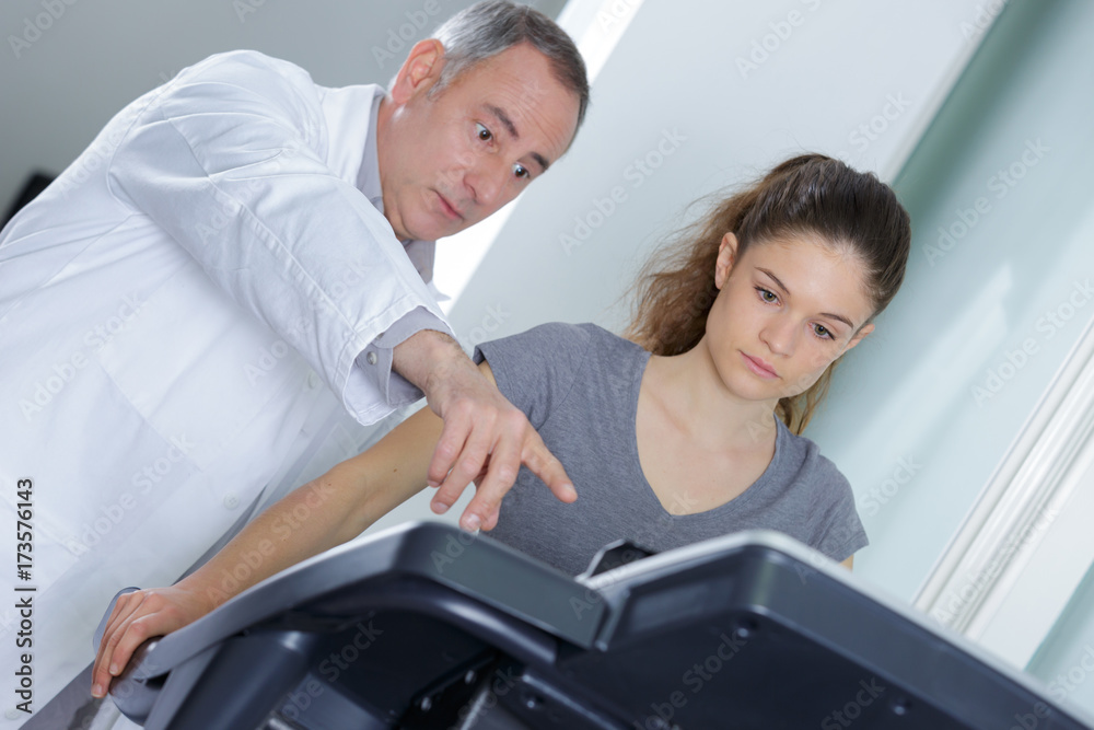 Anxious teacher pointing student to equipment Anxious teacher pointing student to equipment