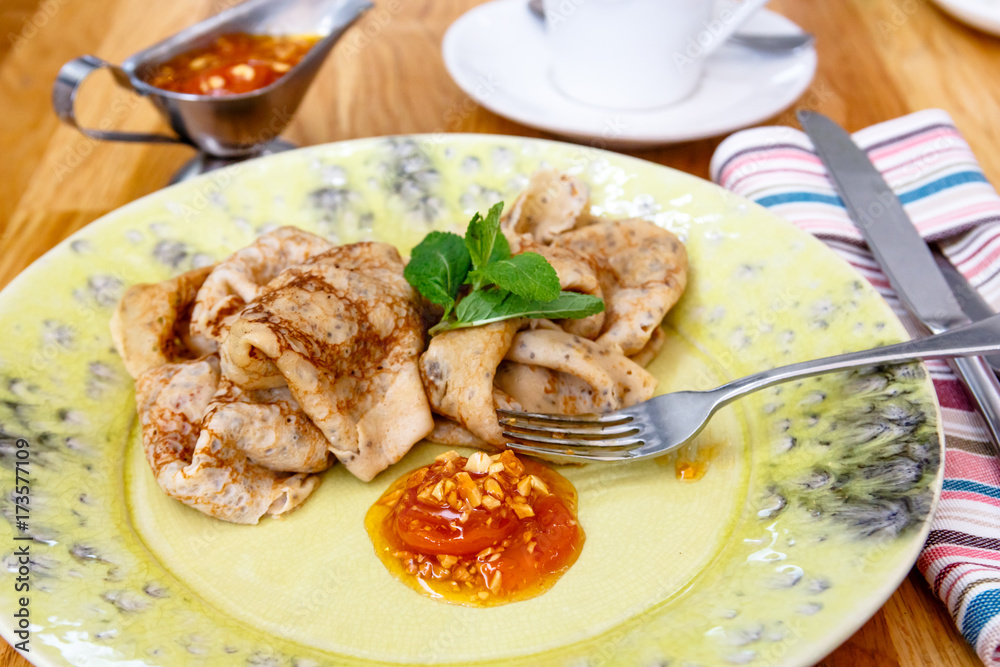 Russian pancakes with jam are on the plate. Breakfast