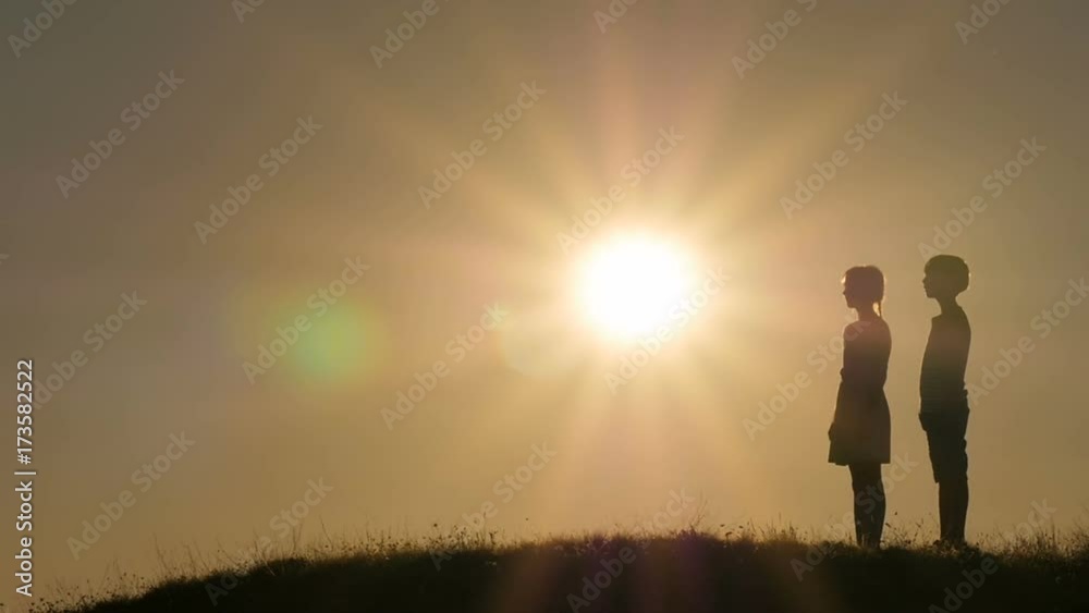 Silhouettes of children against the sky and sun. Backlight. Silhouettes of children against the sky and sun. Backlight.