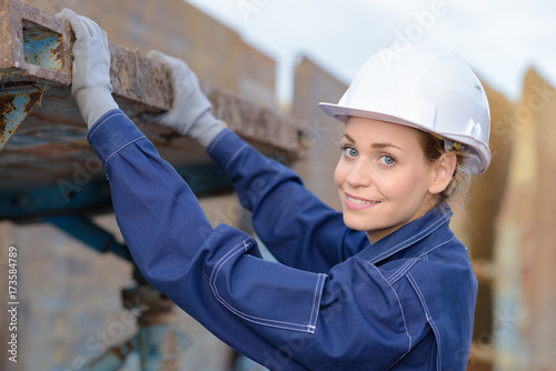 Obraz na plátně female worker outside hands on scaffold