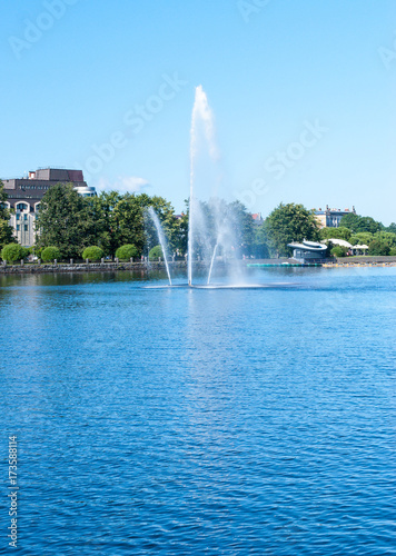 River with a fountain on a sunny day