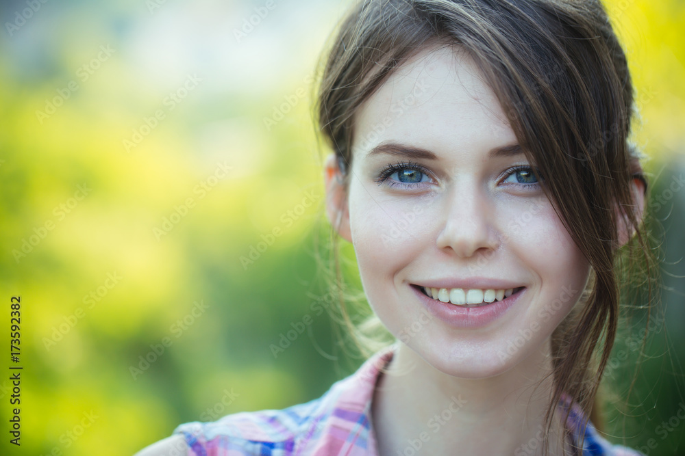 Happy girl with brunette hair, hairstyle, outdoors