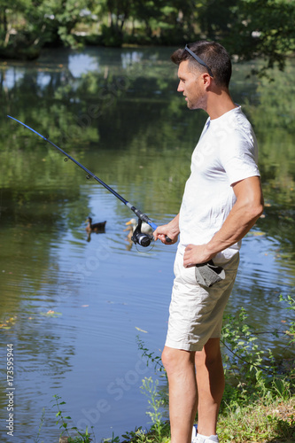 fishing man with fishing rod river outdoor