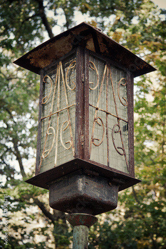Old rusty abandoned metal lantern