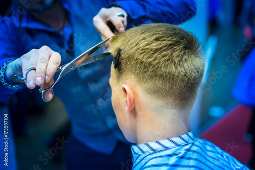 The man is cutting his hair...