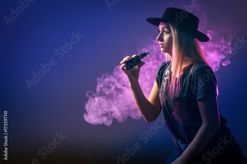 young woman smoking electro...