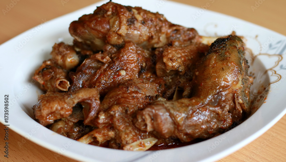 Duck Rica Rica. Hot and spicy cuisine from Manado, North Sulawesi, Indonesia. Uses a lot of chopped or ground red and green chili peppers, bird's eye chili, shallots, garlic, and ginger. Duck Rica Rica. Hot and spicy cuisine from Manado, North Sulawesi, Indonesia. Uses a lot of chopped or ground red and green chili peppers, bird's eye chili, shallots, garlic, and ginger.
