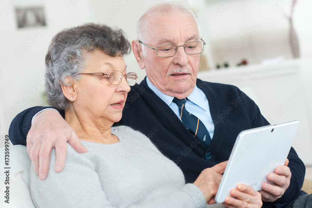 happy senior couple with tablet pc computer at home happy senior couple with tablet pc computer at home
