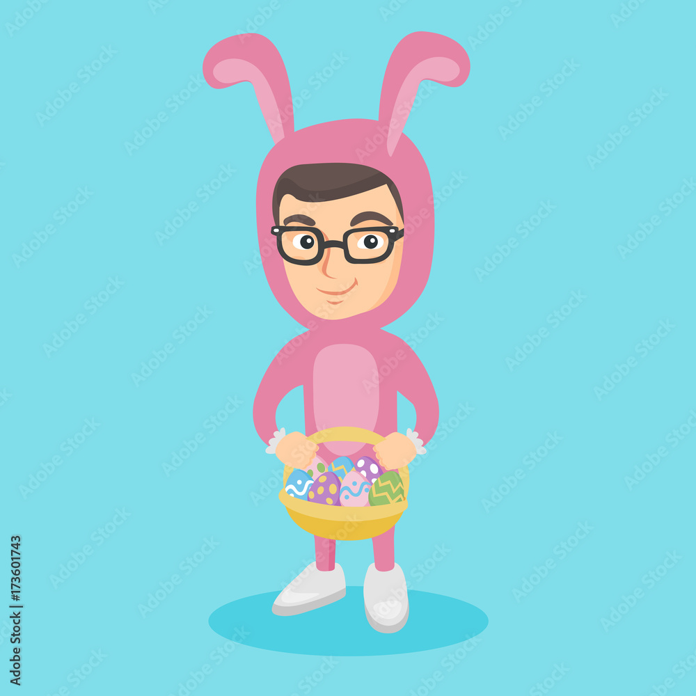 Little caucasian boy wearing a rabbit costume and carrying a basket with easter eggs Little caucasian boy wearing a rabbit costume and carrying a basket with easter eggs