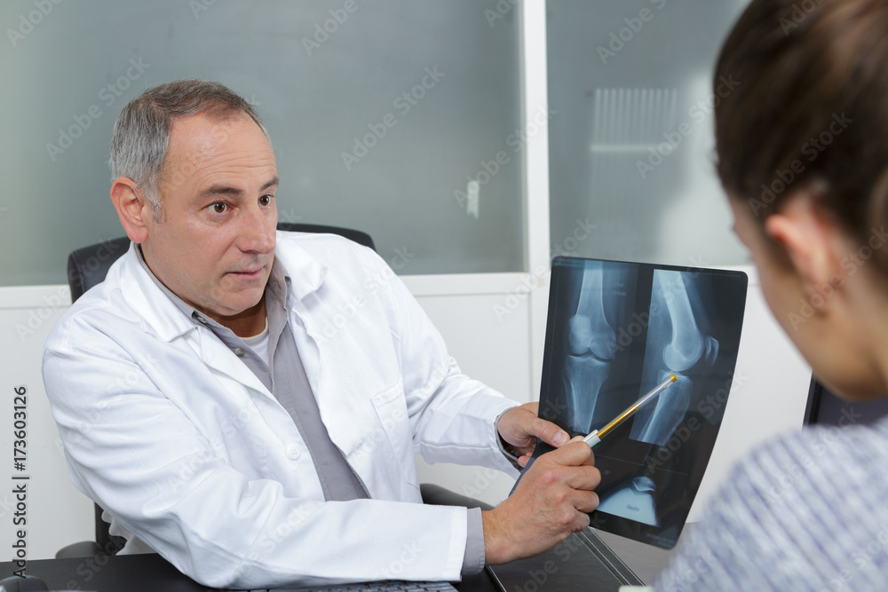 Fototapeta premium doctor xray imagery examination on the laptop computer