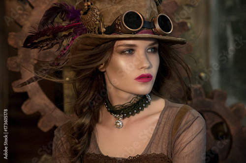 Beautiful girl, model in the style of a steampunk in a beautiful creative studio. Fashion, style, beauty.