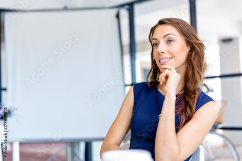 Portrait of businesswoman working at her desk in office