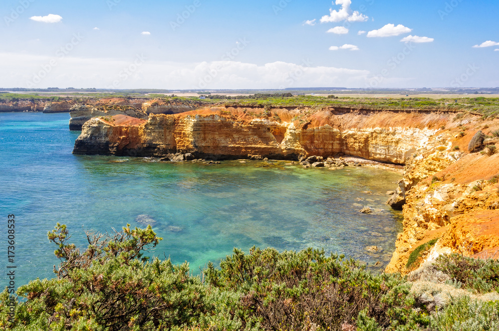 Slowly but surely the blasting winds and waves gradually erode the limestone and form caves in the cliffs - Bay of Martyrs, Victoria, Australia Slowly but surely the blasting winds and waves gradually erode the limestone and form caves in the cliffs - Bay of Martyrs, Victoria, Australia