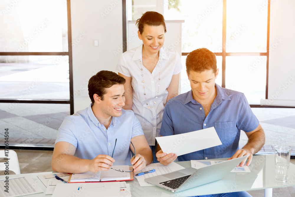 Group of happy young business people in a meeting