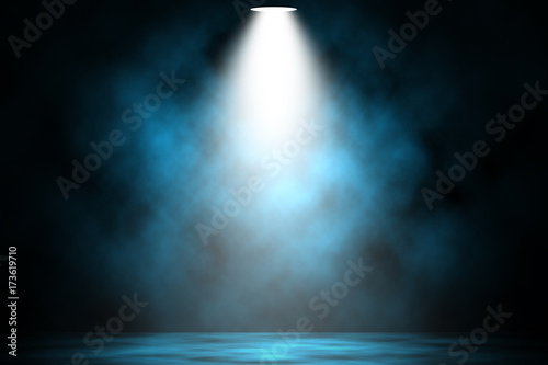 Blue spotlight smoke stage entertainment background.