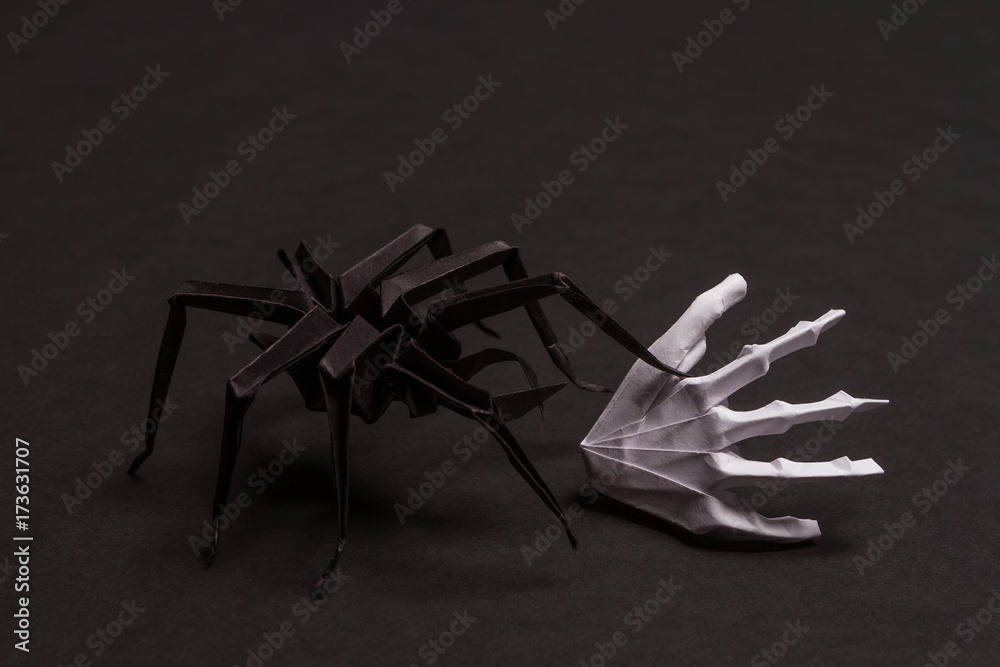 Fototapeta premium Black Halloween Background with White Skeleton Hands