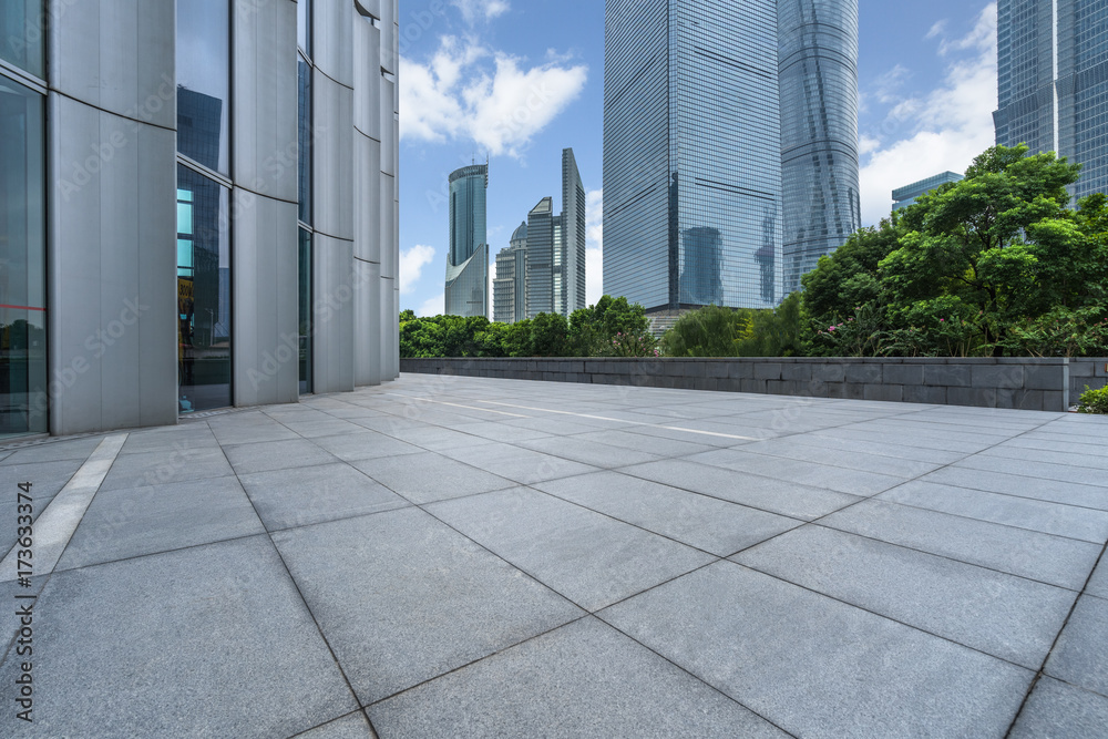 cityscape and skyline of shanghai from empty brick floor.