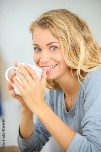 young woman eating her french breakfast: healthy food concept