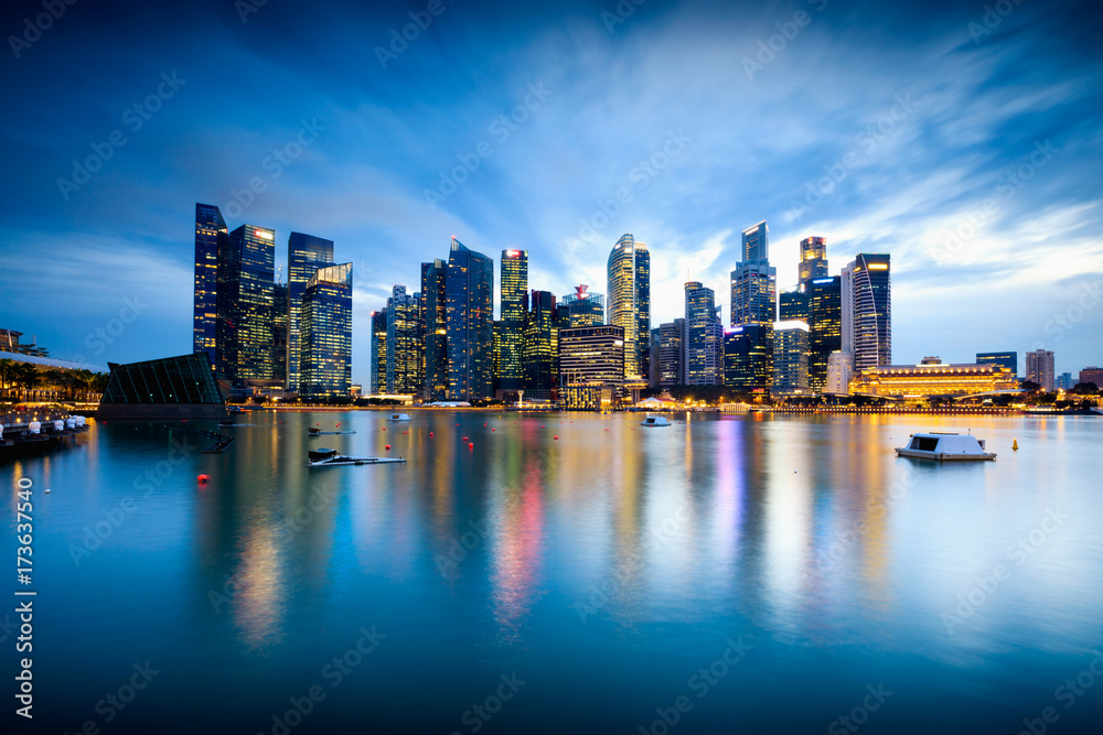 Fototapeta premium Beautiful illuminated Singapore central business district skyline at dusk under blue hour night sky, Singapore, Asia. Long time exposure