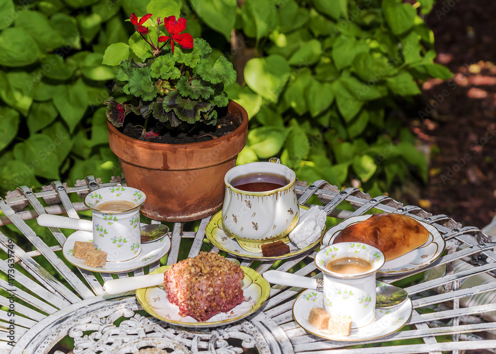 A table with tea, coffee, sweets and pastries A table with tea, coffee, sweets and pastries