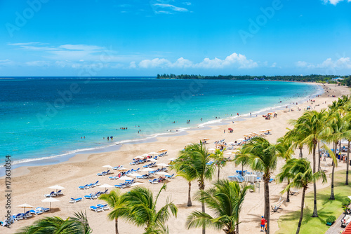 Puerto Rico beach travel vacation landscape background. Isla Verde resort in San Juan, famous tourist cruise ship destination in the Caribbean. photo