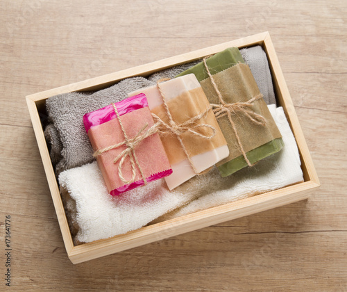 Handmade soap and towels in wooden box