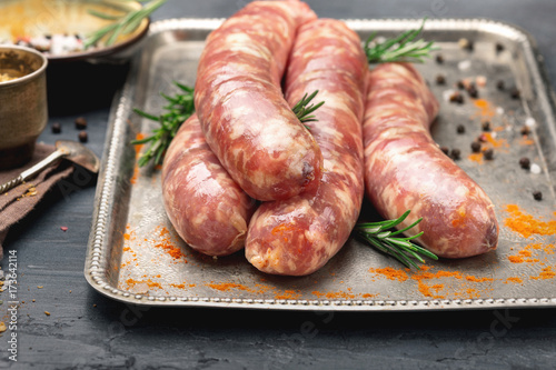 Raw sausages for grilling close up on tray
