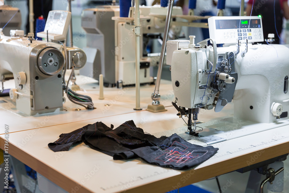 Sewing machine and cloth in cutting shop, nobody