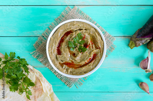Baba ganush - hummus from eggplant with seasoning, parsley. Eastern cuisine. photo