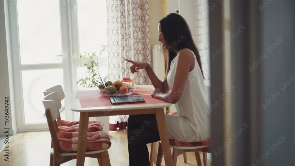 Young woman on laptop video chat at home Young woman on laptop video chat at home