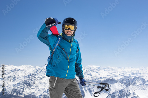 Man carrying ski equipment